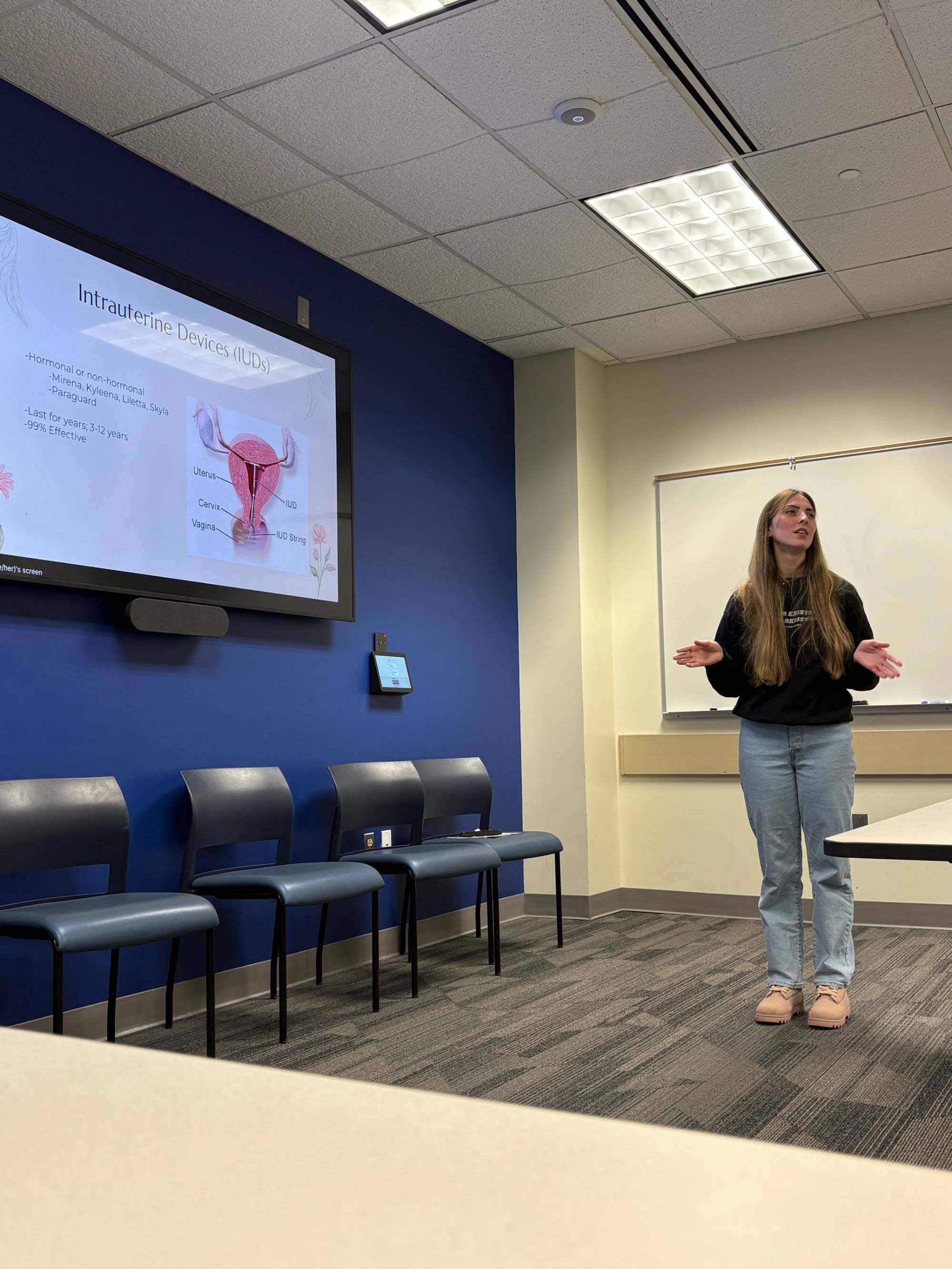 Image of a female presenting about the uterus